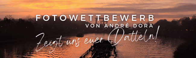 Hinweis Fotowettbewerb "Zeigt uns euer Datteln!" - im Hintergrund ist ein Schiff auf dem Wesel-Datteln-Kanal im Sonnenaufgang zu sehen